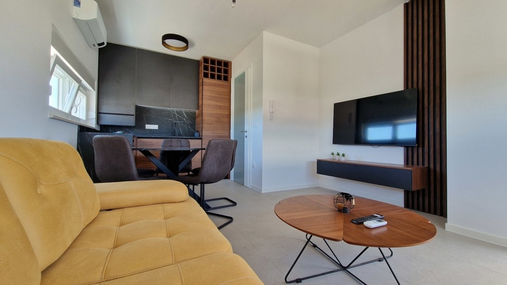 Bright living area with seating area and television