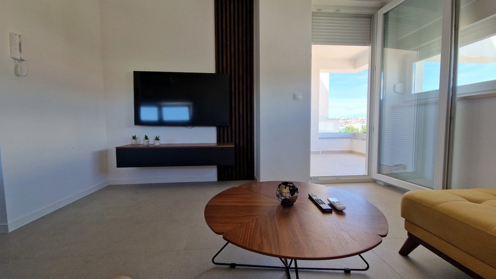 Living area with loggia access and sea views