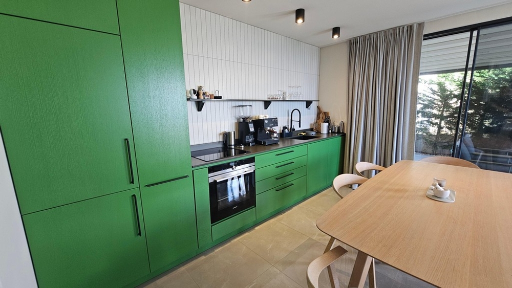 Modern fitted kitchen with dining table in Krk, Croatia