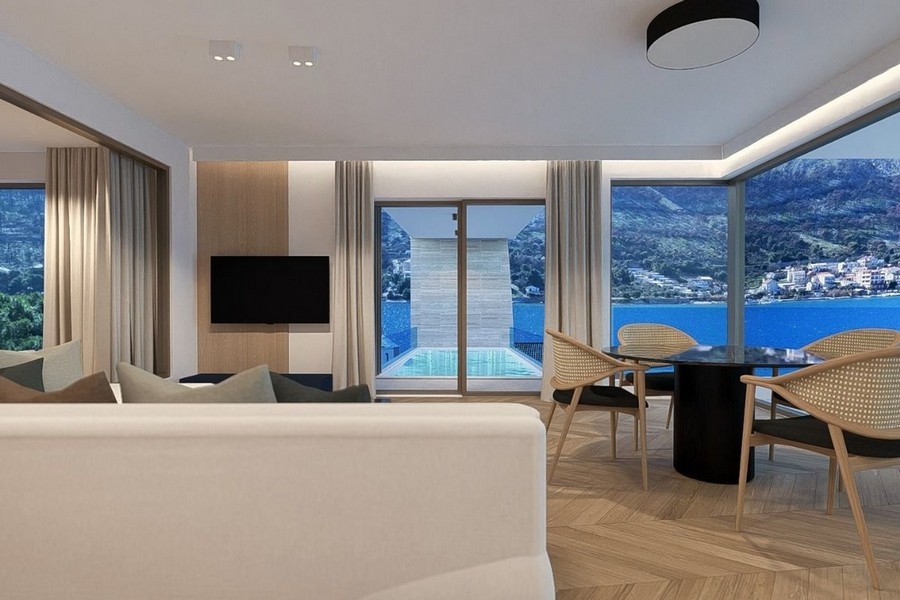 Living room with open kitchen and sea views