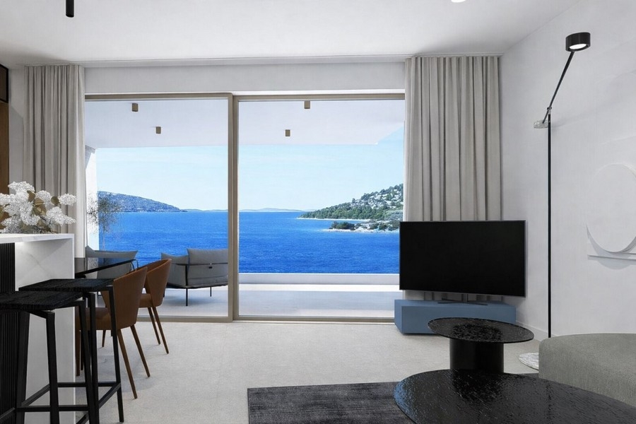Bright living area with sea views and terrace access