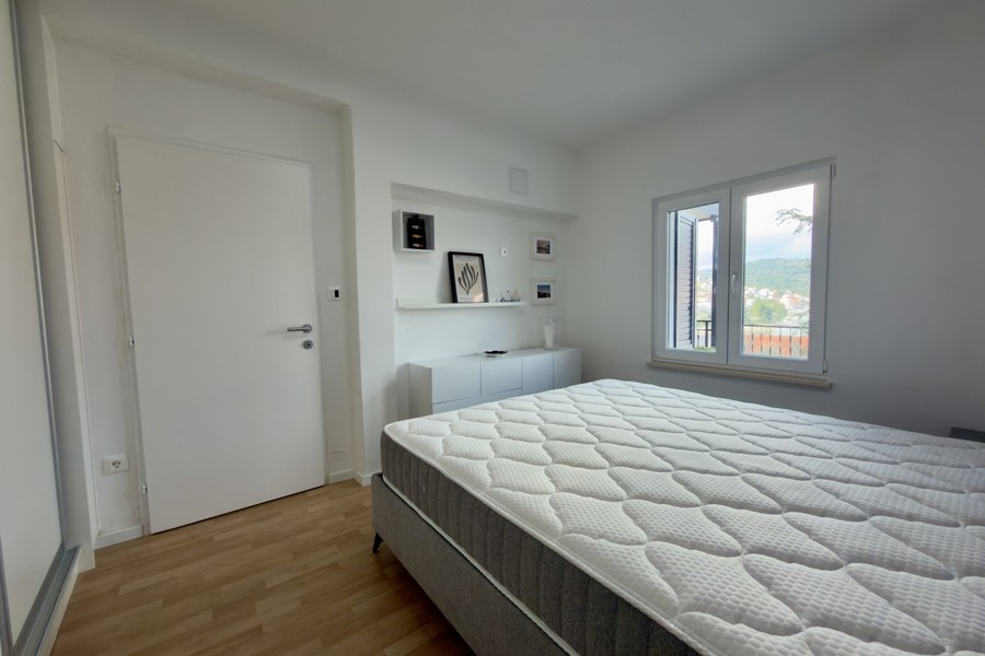 Bedroom with double bed and storage space