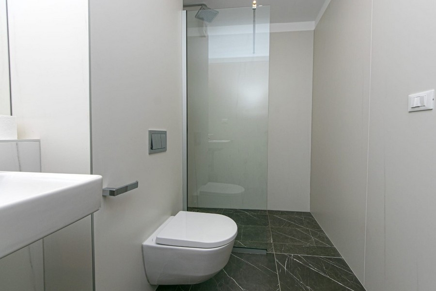 Bathroom with walk-in shower and toilet