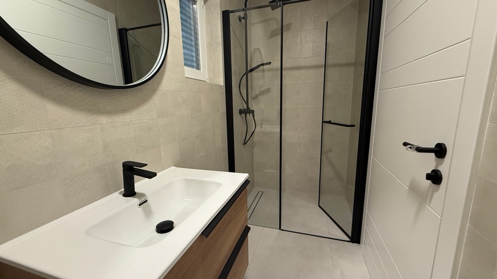 Bathroom with shower and vanity