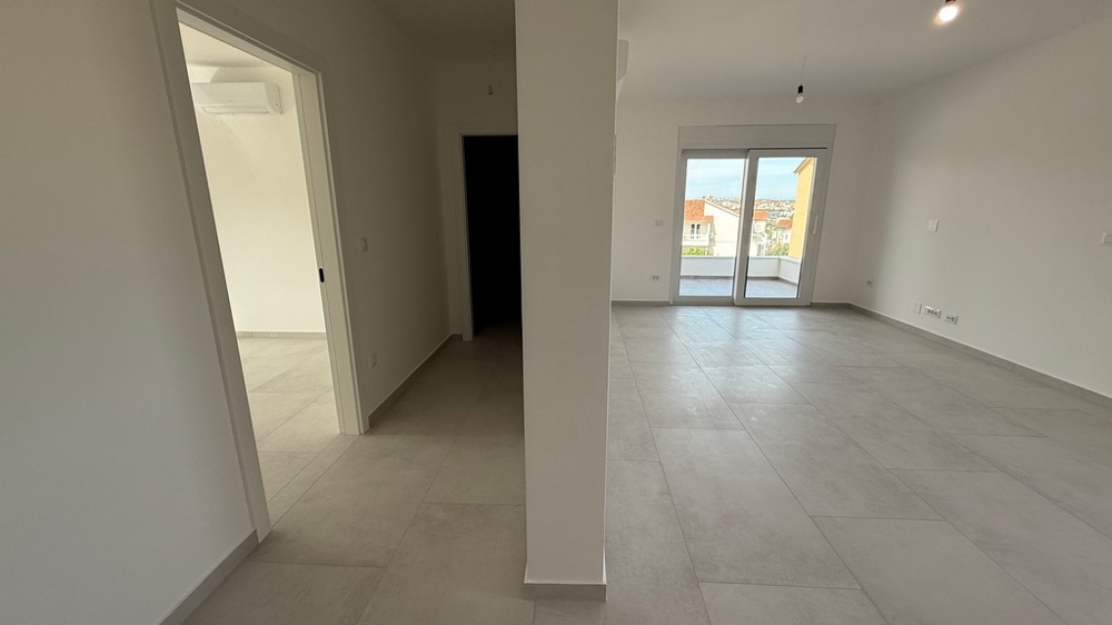 Spacious living room with large windows