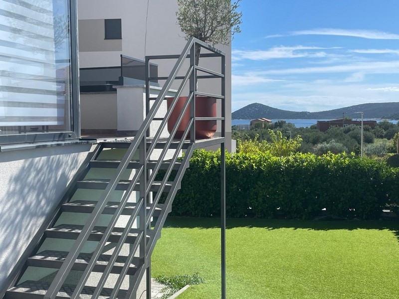 External stairs in the garden with sea views