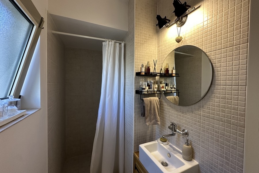 Bathroom with sink and mirror