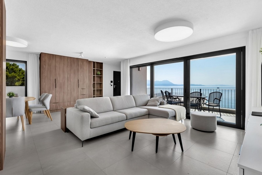 Bright living area with sofa and sea views