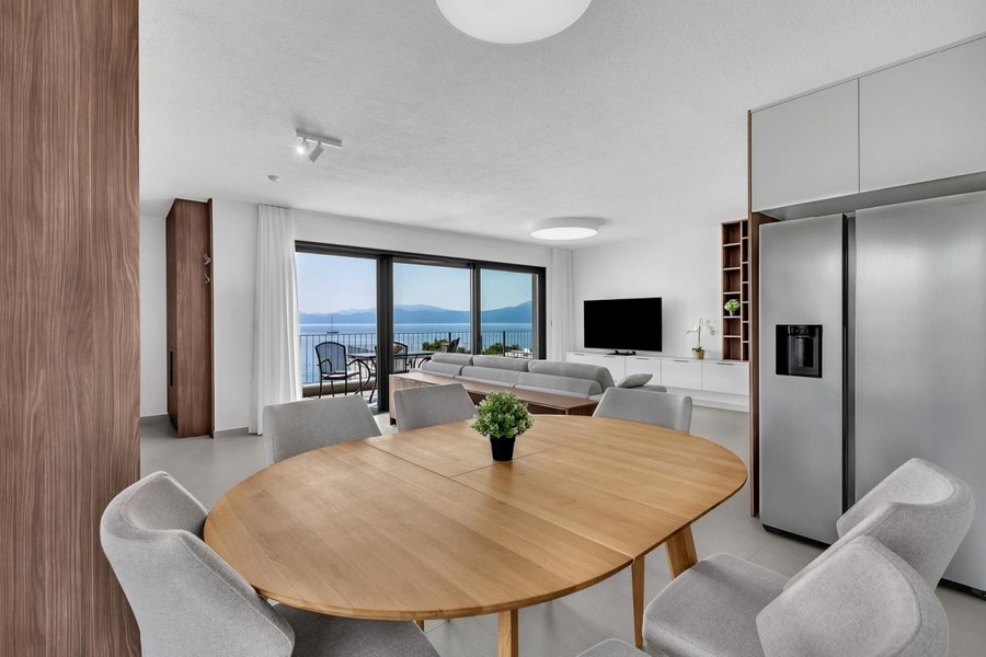 Dining room with open kitchen and sea views