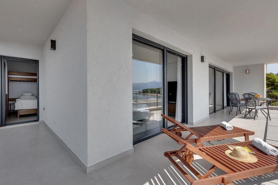 Room with terrace access and seating area