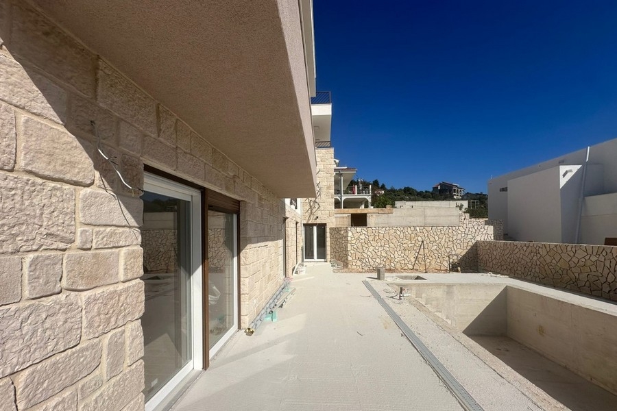 Terrace with natural stone facade and pool area