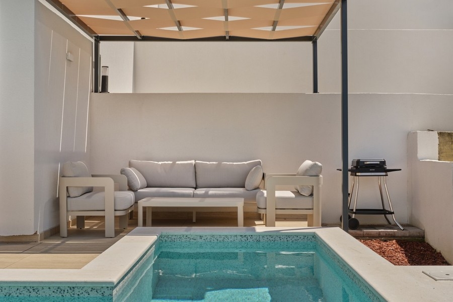 Covered terrace with poolside seating area