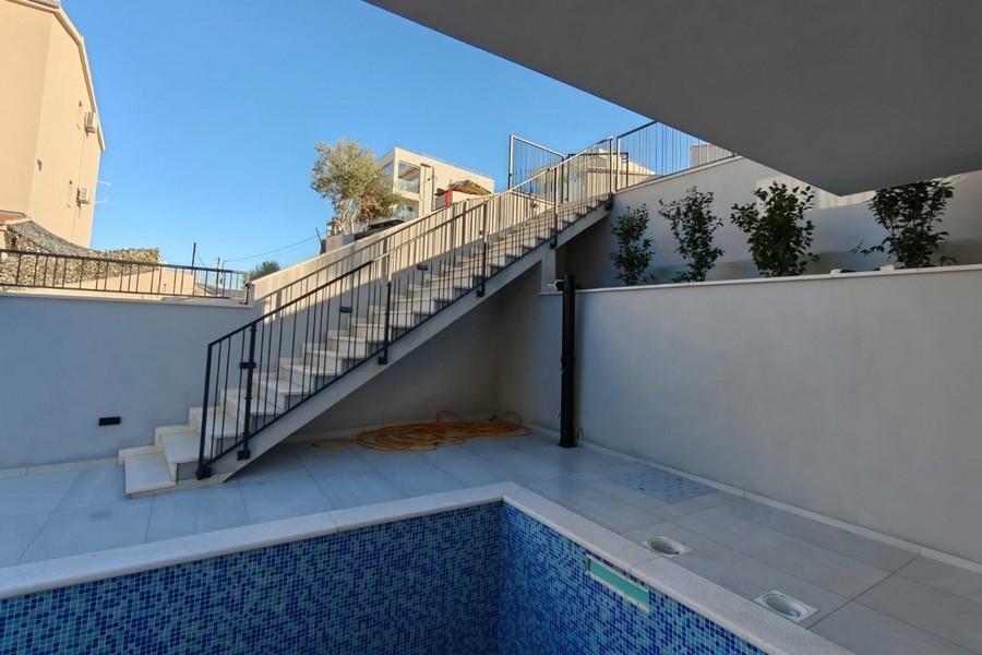 Outdoor area with stairs and pool