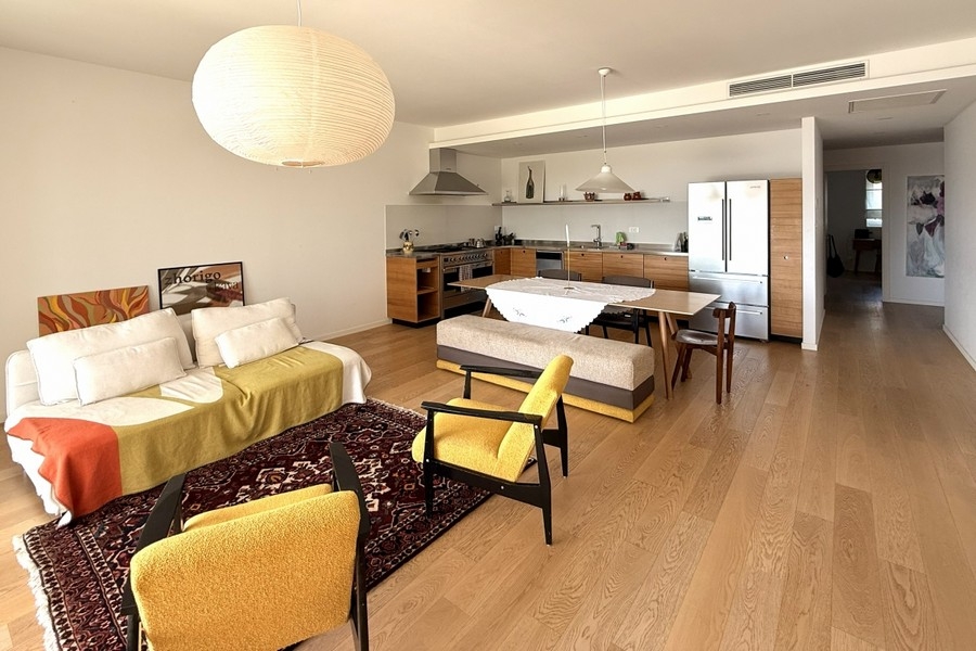 Living area with kitchen island in Split