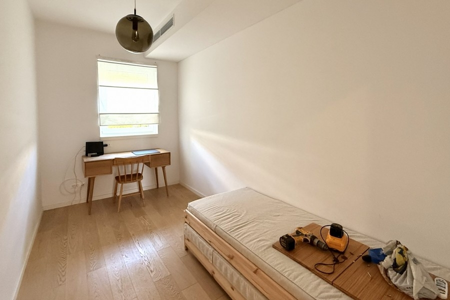 Room with a workstation by the window