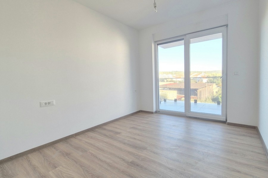 Room with wooden floor and French window