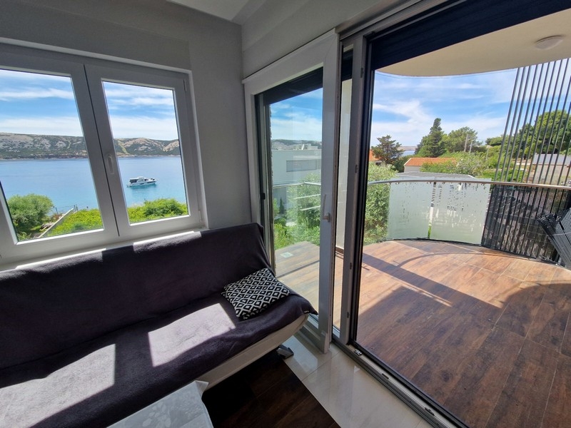Living area with sea views and access to the balcony