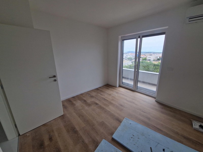 Living room with flooring and large windows