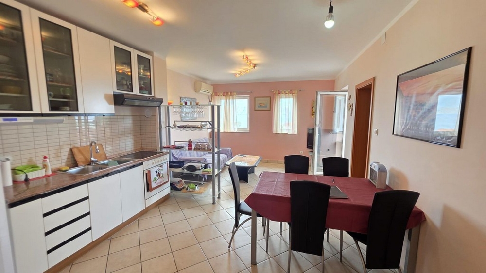 Open living area with kitchen and table