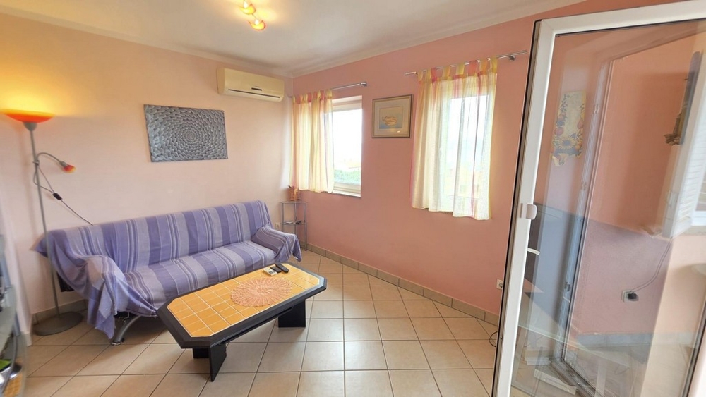 Living room with sofa and air conditioning
