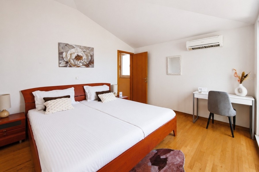 Bedroom with double bed and workplace