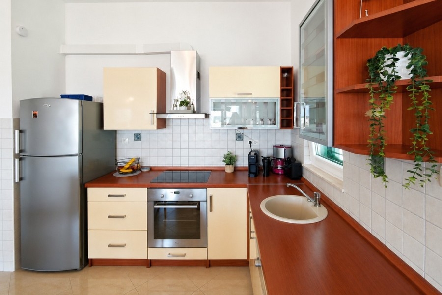 Kitchen with oven and refrigerator