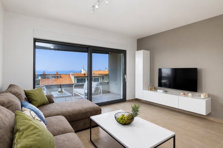 Living area with access to the terrace and views of the sea
