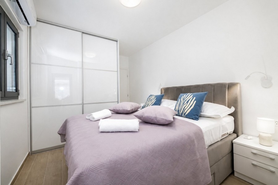 Bedroom with double bed and built-in wardrobe