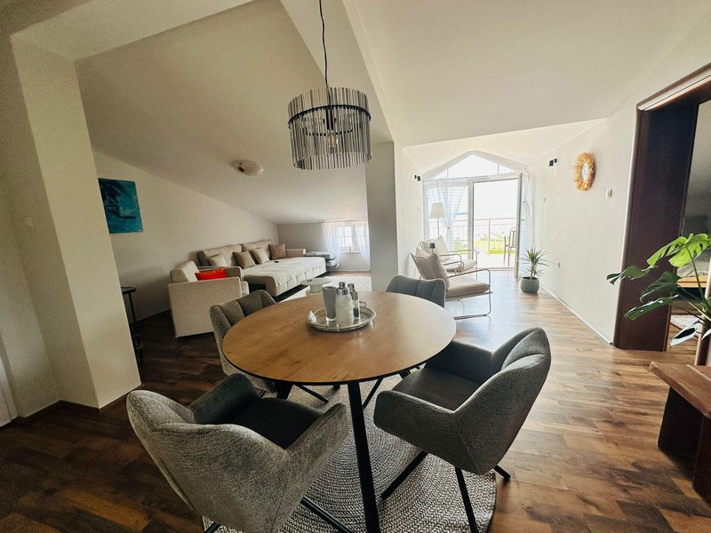 Living area with round table and sofa
