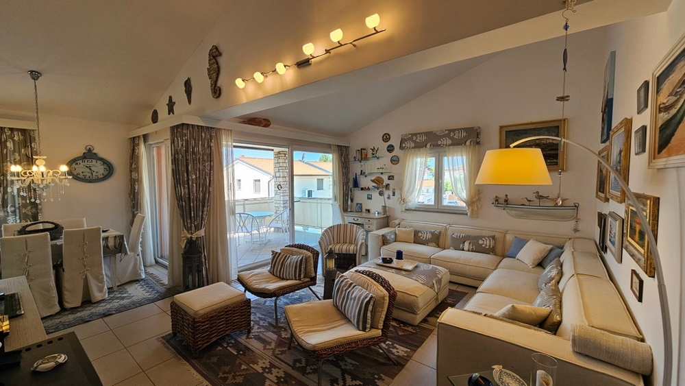 Living area with sofa and large window