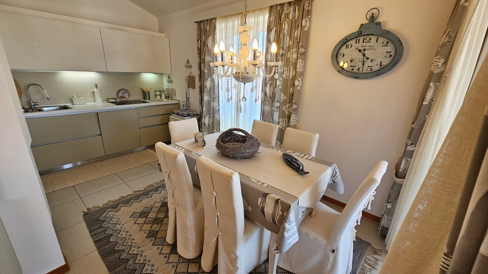 Dining area with table and chandelier