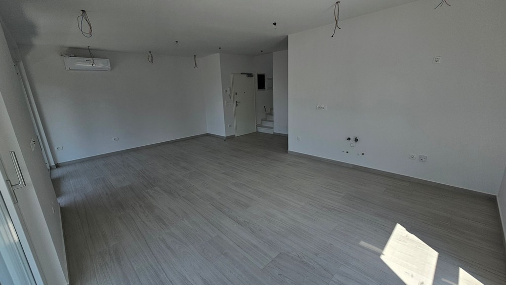 Interior with air conditioning and wooden floor