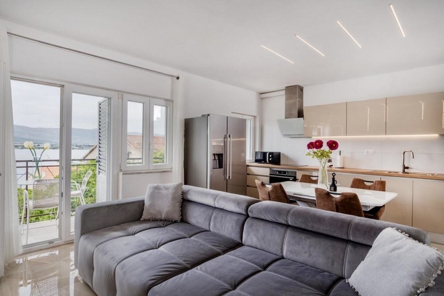 Living area with sofa and open kitchen