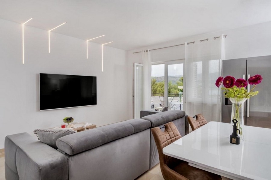 Bright living area with TV and sofa