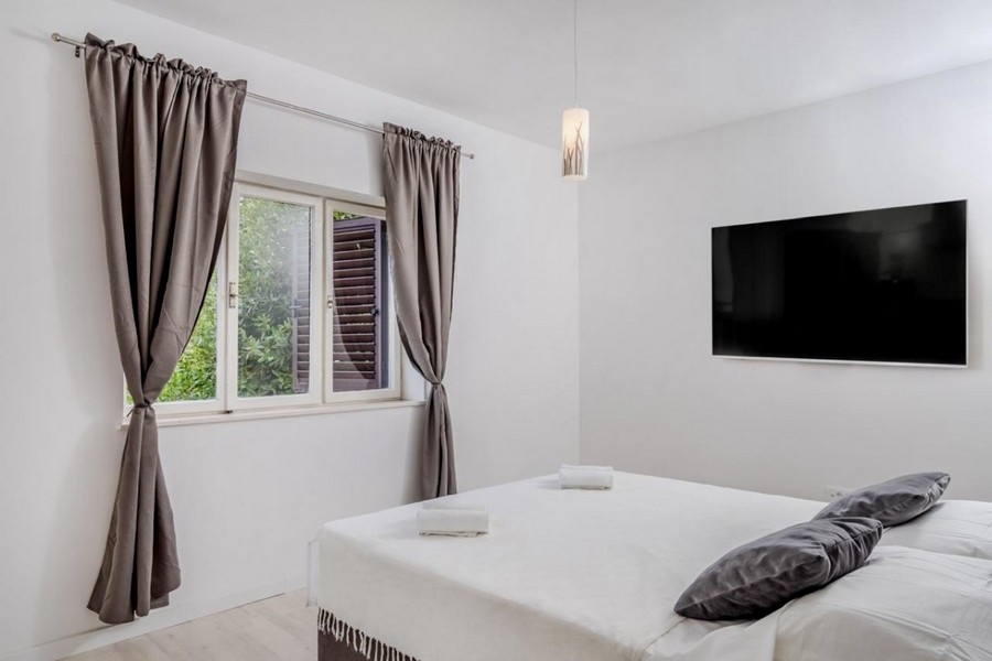 Bedroom with bed and television