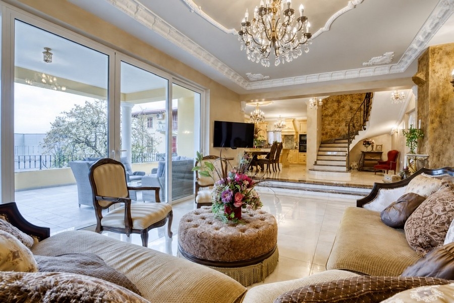 Living room with stucco ceiling and terrace access