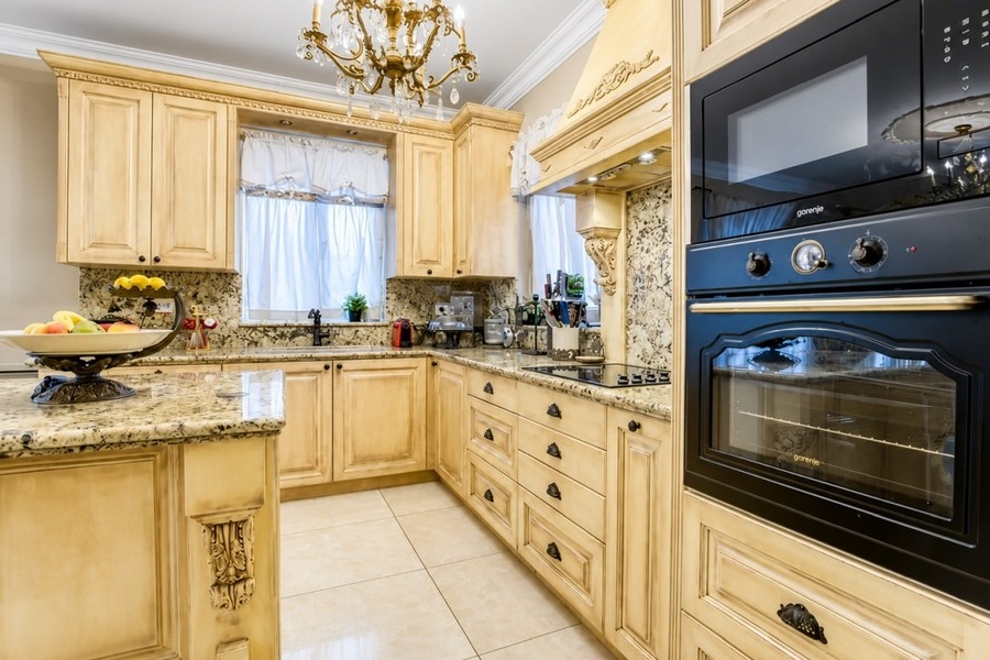 Kitchen with granite worktops and built-in appliances