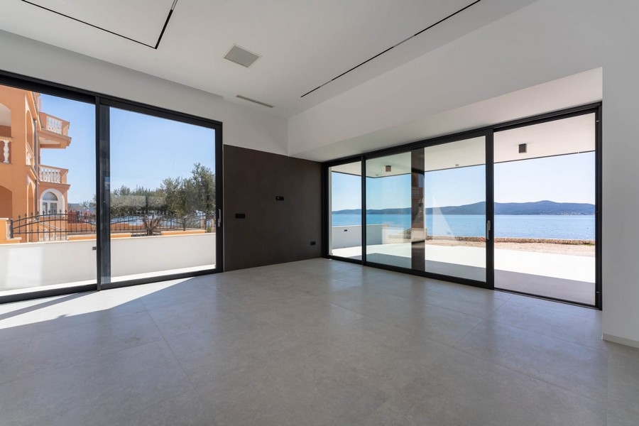 Living area with terrace access and sea views