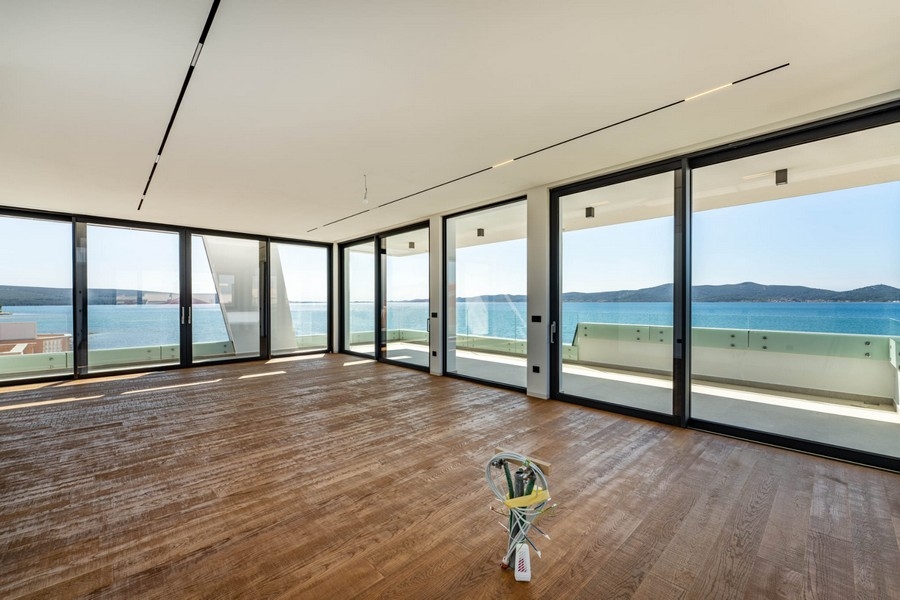 Open living area with parquet floors and sea views