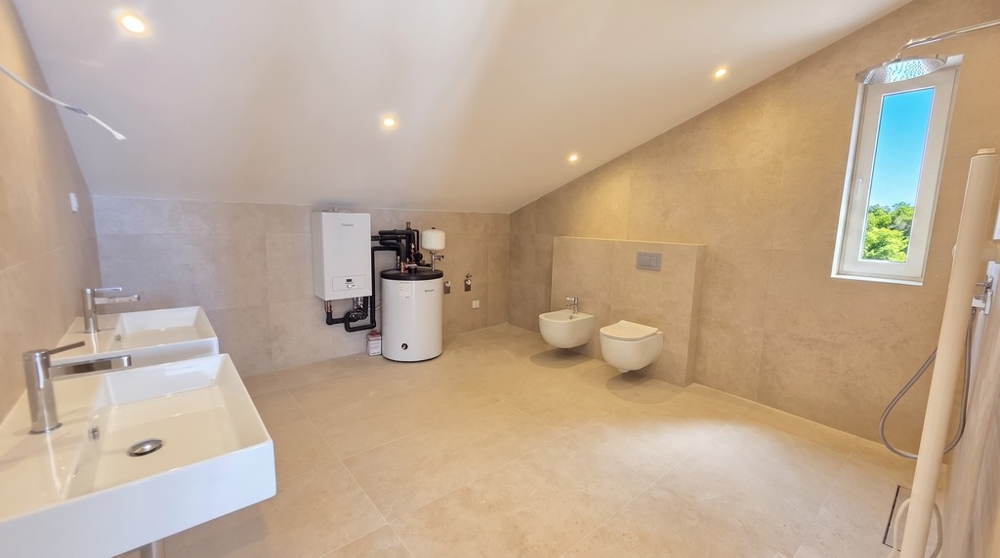 Bathroom with window and water heater