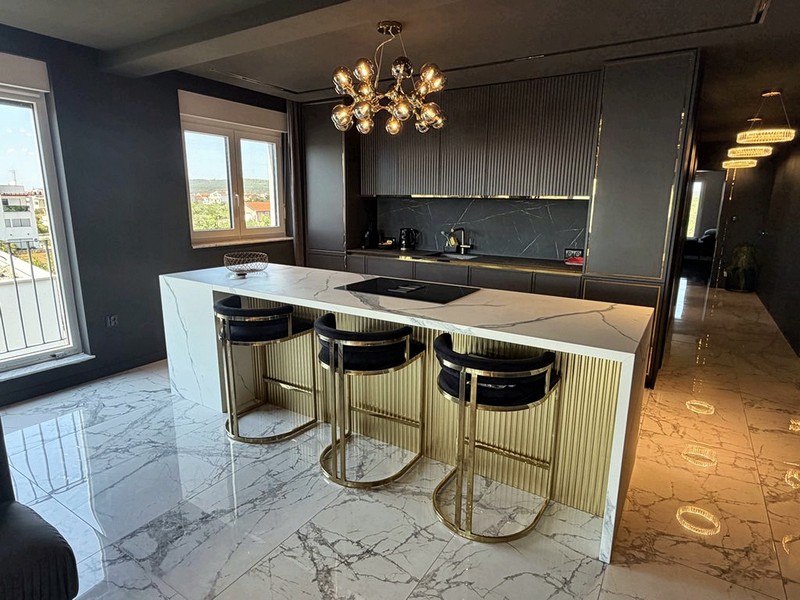 Kitchen with island and bar stools