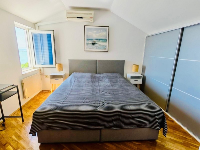 Bedroom in the attic with built-in wardrobe