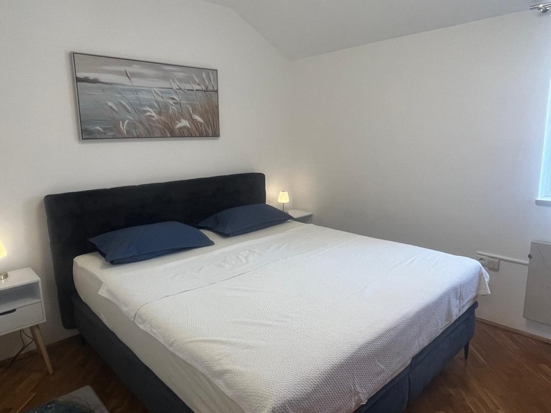 Bedroom with double bed and bedside tables