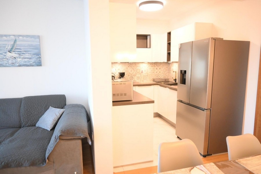 Kitchen with refrigerator and seating area