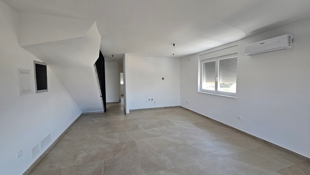 Bright living area of ​​the new apartment with air conditioning