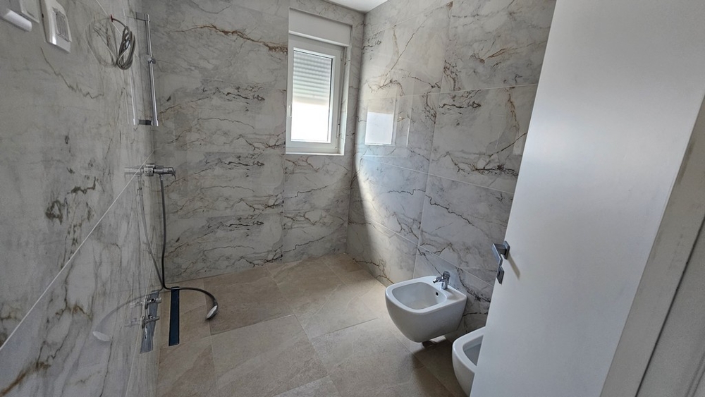 Modern bathroom with shower and marble look