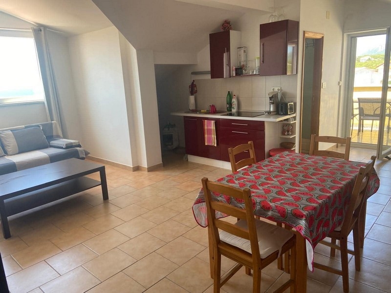 Living room with sofa and kitchenette