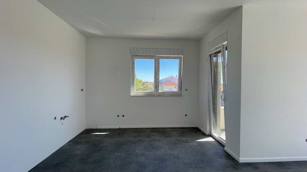 View from the bedroom into the bright living area of ​​apartment A4073