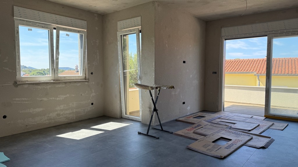 Living room with windows to the terrace