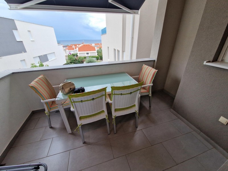 Covered terrace with seating area and sea view in Croatia